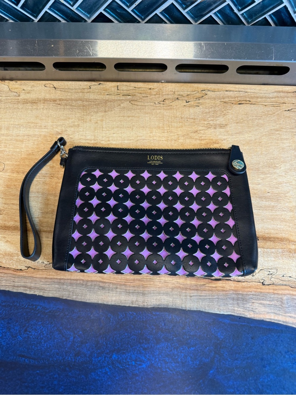 Lodis Leguna Koto Black Wristlet with Purple Cutout Geometric Panel